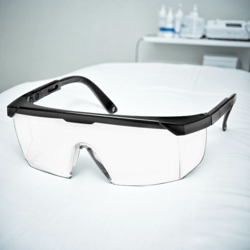 Veiligheidsbril voor laserklinieken naast een ipl machine voor laser ontharing met ultrasound gel 