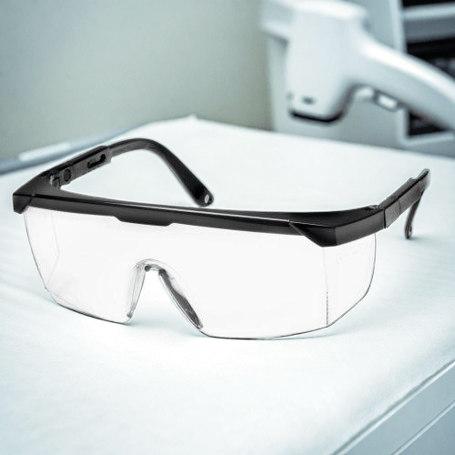 Veiligheidsbril voor laserklinieken naast een ipl machine voor laser ontharing met ultrasound gel 